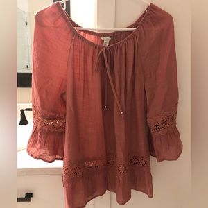 Rose colored bell sleeve lace trimmed top